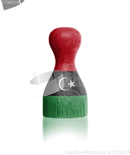 Image of Wooden pawn with a flag painting