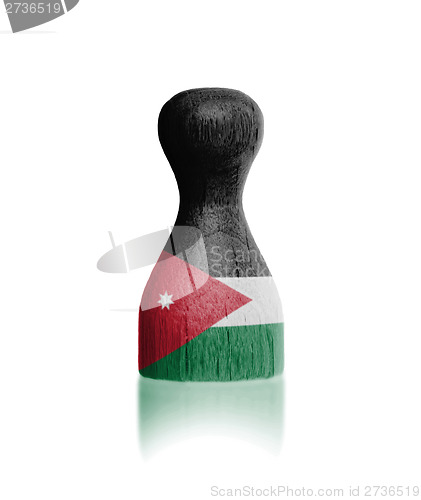 Image of Wooden pawn with a flag painting
