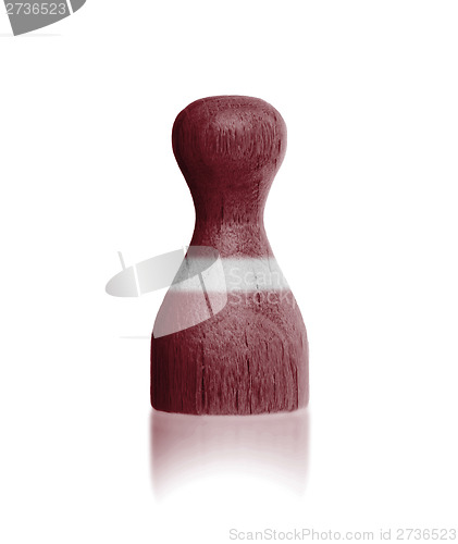 Image of Wooden pawn with a flag painting
