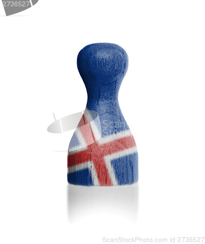Image of Wooden pawn with a flag painting