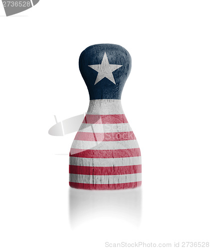 Image of Wooden pawn with a flag painting