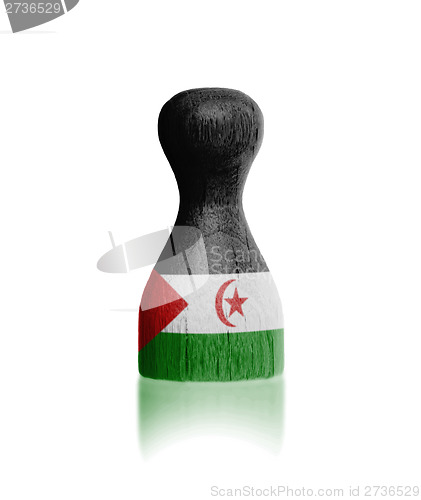 Image of Wooden pawn with a flag painting