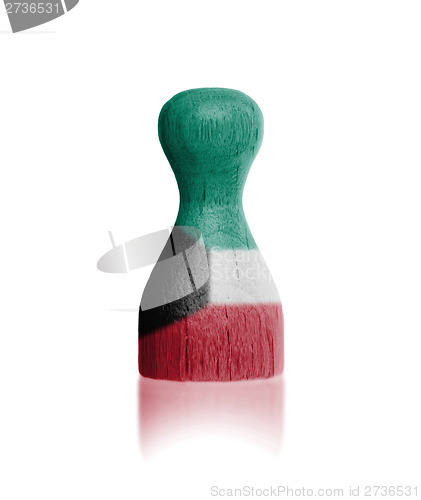Image of Wooden pawn with a flag painting