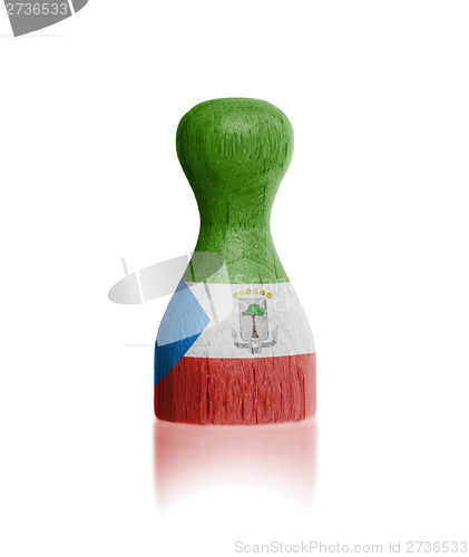 Image of Wooden pawn with a flag painting