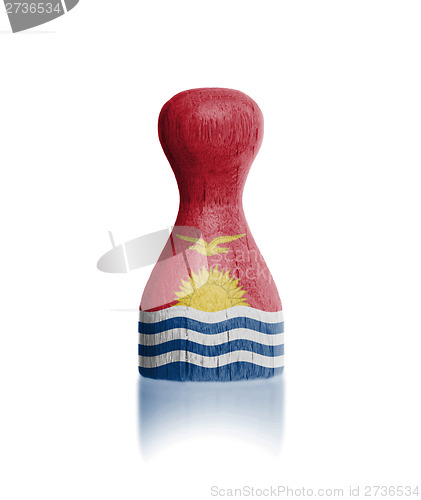 Image of Wooden pawn with a flag painting
