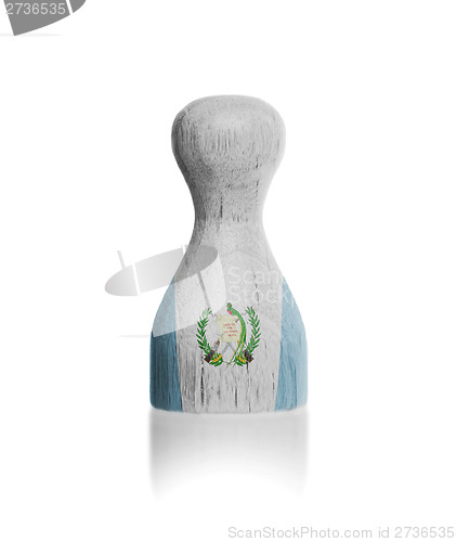 Image of Wooden pawn with a flag painting