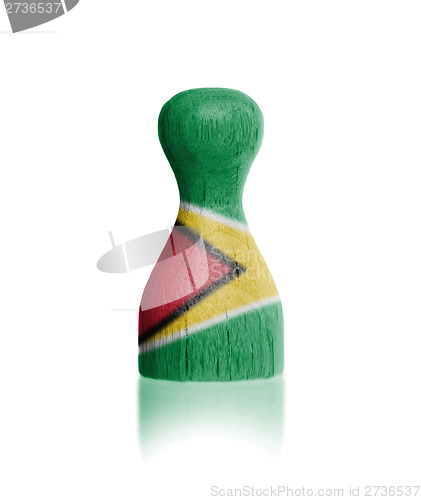 Image of Wooden pawn with a flag painting