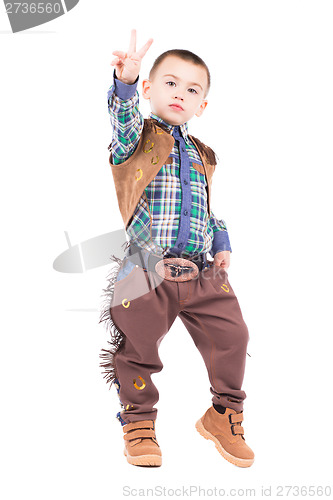 Image of Little boy posing in cowboy costumes