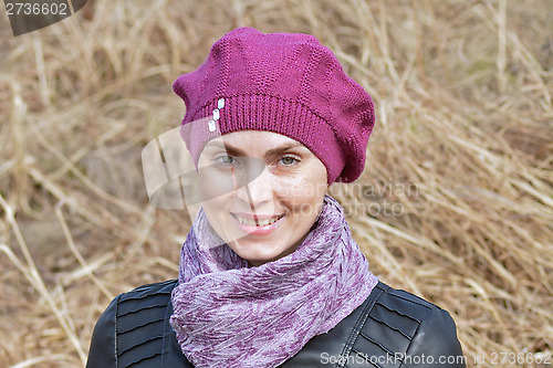 Image of  Woman in pink beret and black leather jacket
