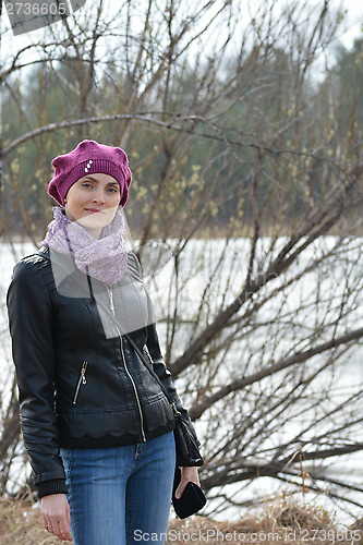 Image of Woman in pink beret and black leather jacket