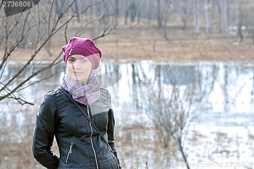 Image of Woman in pink beret and black leather jacket