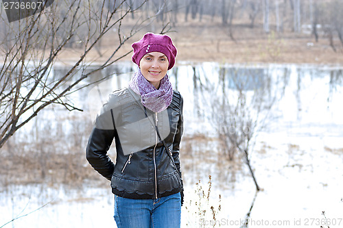 Image of Woman in pink beret and black leather jacket