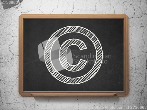 Image of Law concept: Copyright on chalkboard background