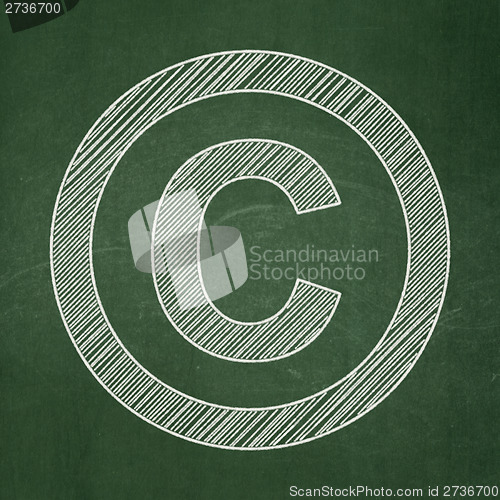 Image of Law concept: Copyright on chalkboard background