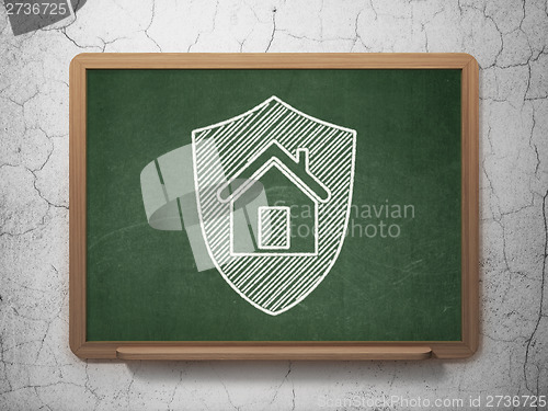 Image of Privacy concept: Shield on chalkboard background
