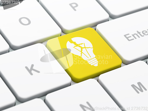 Image of Business concept: Light Bulb on computer keyboard background