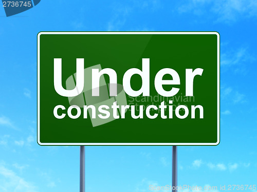 Image of Web design concept: Under Construction on road sign background