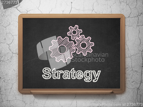 Image of Business concept: Gears and Strategy on chalkboard background