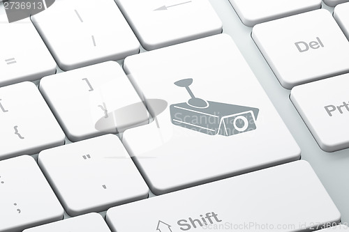 Image of Safety concept: Cctv Camera on computer keyboard background