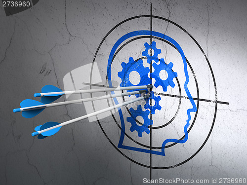 Image of Information concept: arrows in Head With Gears target on wall