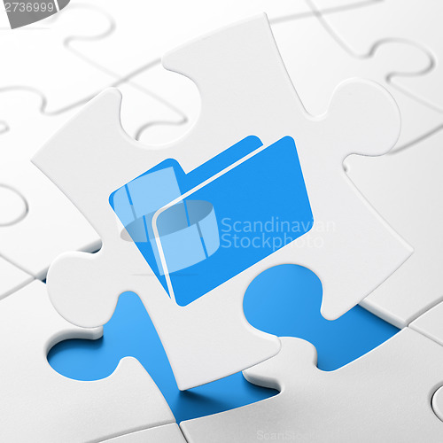 Image of Finance concept: Folder on puzzle background