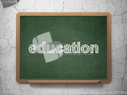Image of Education on chalkboard background