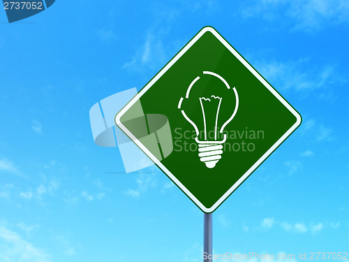 Image of Finance concept: Light Bulb on road sign background