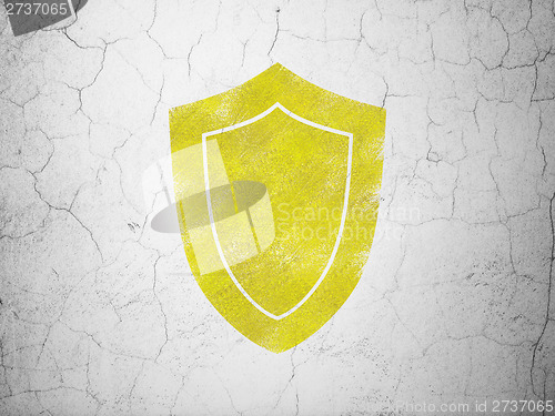 Image of Privacy concept: Shield on wall background