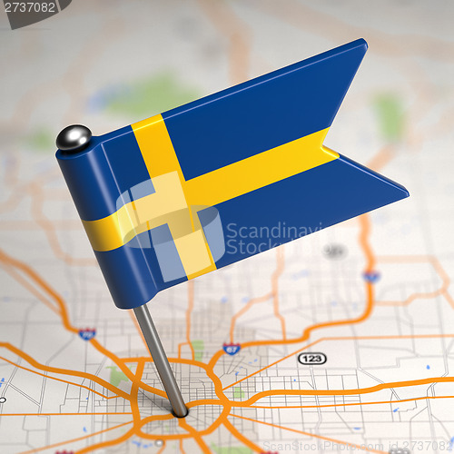 Image of Sweden Small Flag on a Map Background.