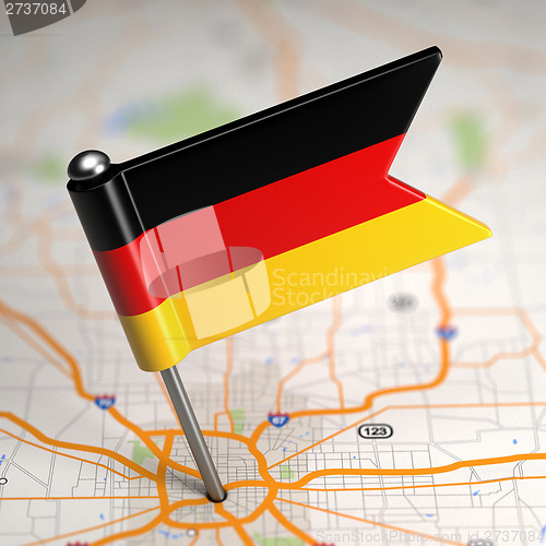 Image of Germany Small Flag on a Map Background.
