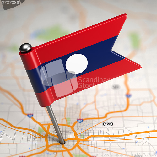 Image of Laos Small Flag on a Map Background.