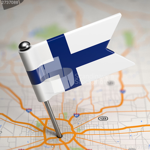 Image of Finland Small Flag on a Map Background.