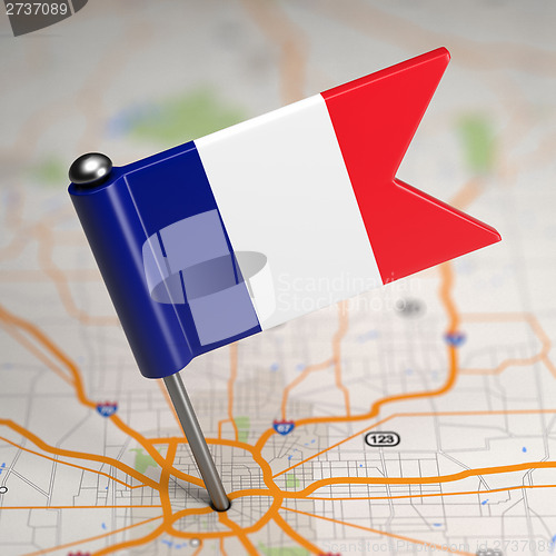 Image of French Small Flag on a Map Background.