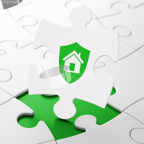 Image of Finance concept: Shield on puzzle background