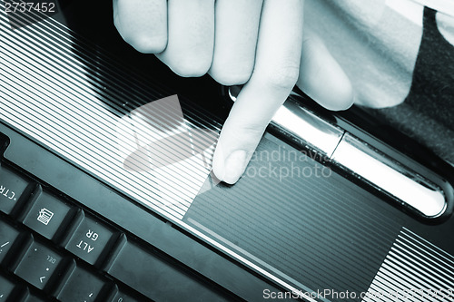 Image of Working at laptop .