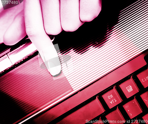 Image of Working at laptop .