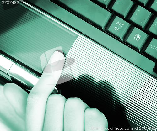 Image of Working at laptop .