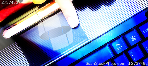 Image of Working at laptop .