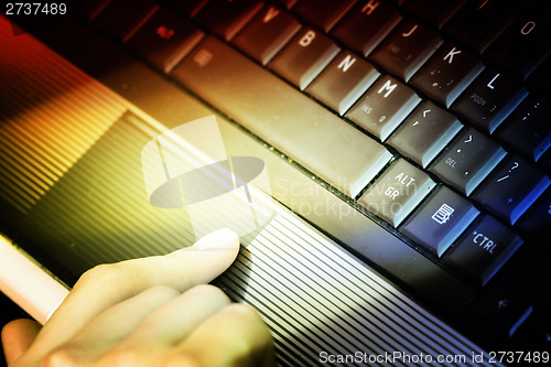 Image of Working at laptop .