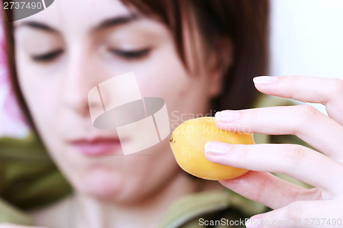 Image of Women with apricot 