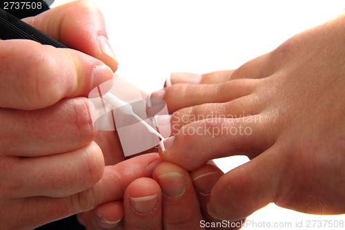 Image of pedicure, making nails (feet) 