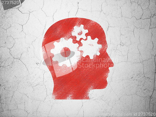 Image of Advertising concept: Head With Gears on wall background