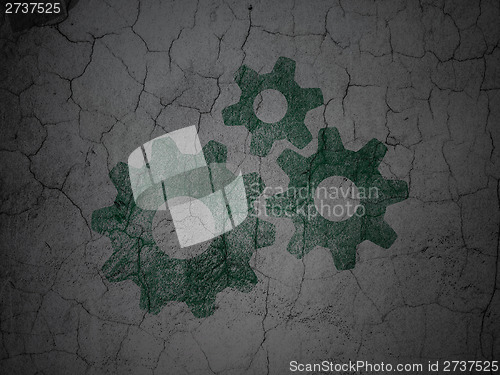 Image of Marketing concept: Gears on grunge wall background