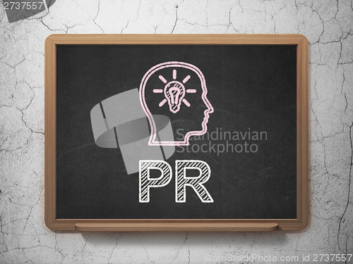 Image of Advertising concept: Head With Lightbulb and PR on chalkboard