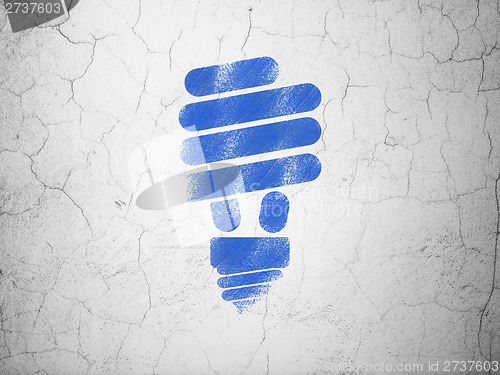Image of Business concept: Energy Saving Lamp on wall background