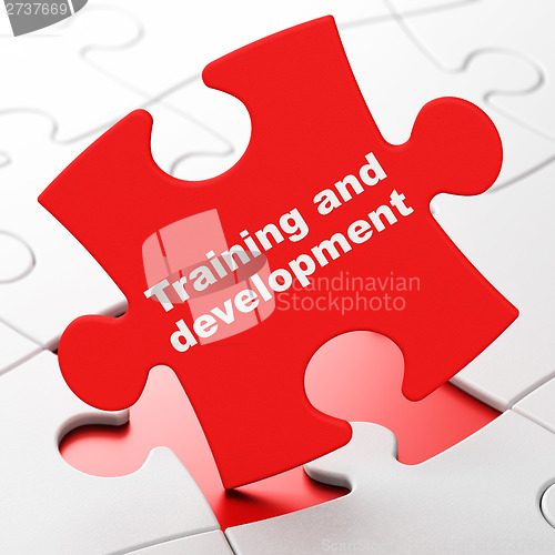 Image of Education concept: Training and Development on puzzle background