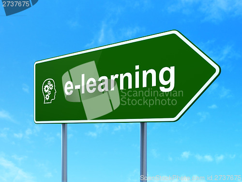 Image of Education concept: E-learning and Head With Gears on road sign