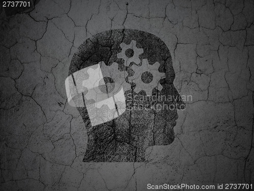 Image of Marketing concept: Head With Gears on grunge wall background