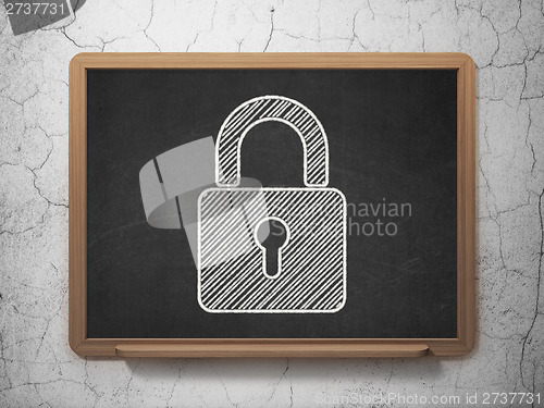 Image of Information concept: Closed Padlock on chalkboard background