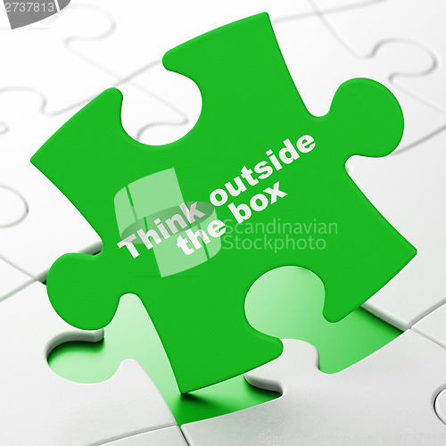 Image of Education concept: Think outside The box on puzzle background